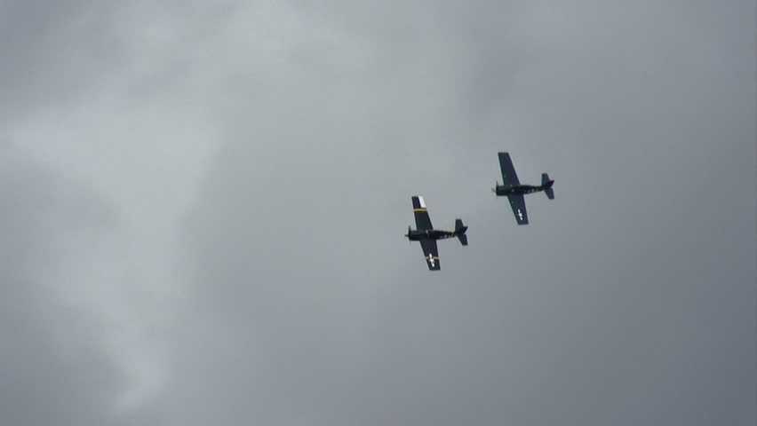 FM-2 Wildcats, WWII fighter planes flying in formation.