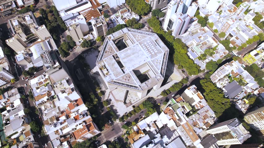 4K drone aerial view of Teatro Argentino in La Plata, Buenos Aires, Argentina. Major cultural landmark surrounded by the city’s urban landscape and distinctive modern architecture.