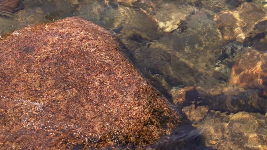 Rocks And Clear Waters Of Jordan Pond In Acadia National Park In Maine, USA. Close-up Shot