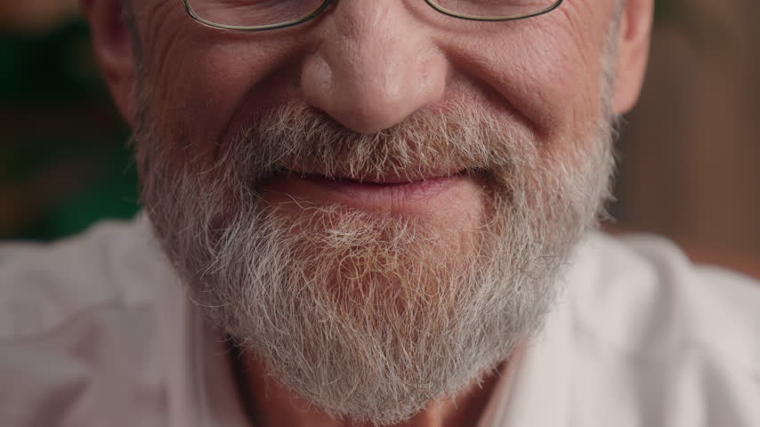 Cropped view mouth half face Caucasian senior bearded man cute smiling unrecognizable business male smile gray beard hair happy pensioner cheerful citizen old elderly aged pensioner carefree emotion 