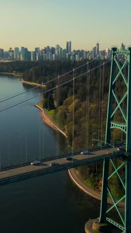 Aerial view of Lions Gate Bridge and Stanley Park at dawn. Canada