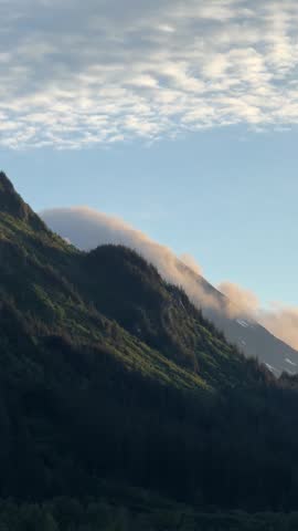 view of clouds rolling through mountains in Alaska