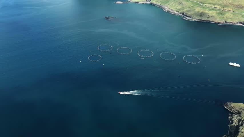 Aerial View of Salmon Farm and Speedboat in Faroe Islands