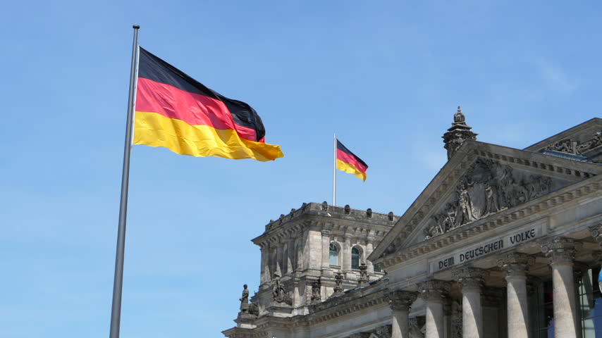 German Flags Flying Above the Reichstag Building in Berlin SLOMO