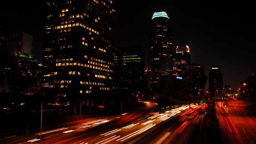 Highway through city at night time lapse
