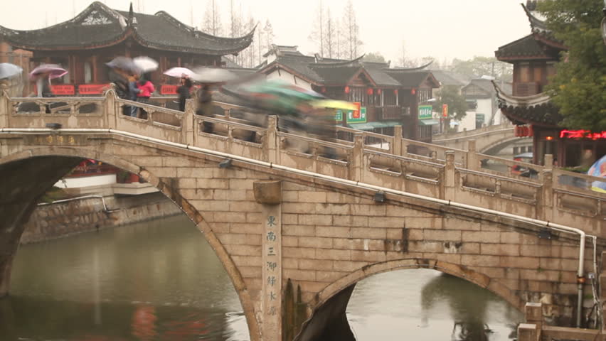SHANGHAI - DECEMBER 16: Qibao Ancient Town stone arch bridge and wooden boat,