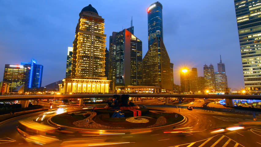 Shanghai skyscraper and city traffic at night - Shanghai, China.