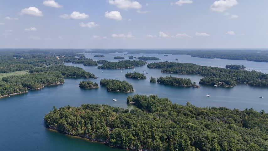 Aerial view of lush islands and blue water in the 1000 Islands region, St. Lawrence River, Canada. g