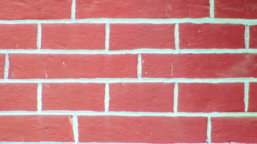 Seamless rotating loop of a modern red brick wall texture with clean white mortar lines and painted clay brickwork patterns.