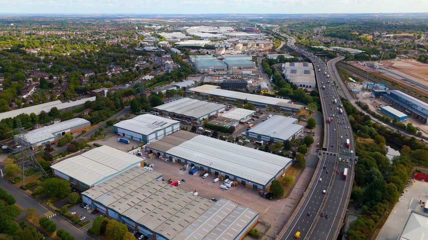High angle drone shot of industrial landscape and motorway in Birmingham