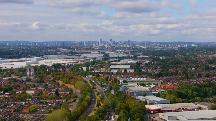 Panorama of residential and industrial areas with Birmingham city skyline