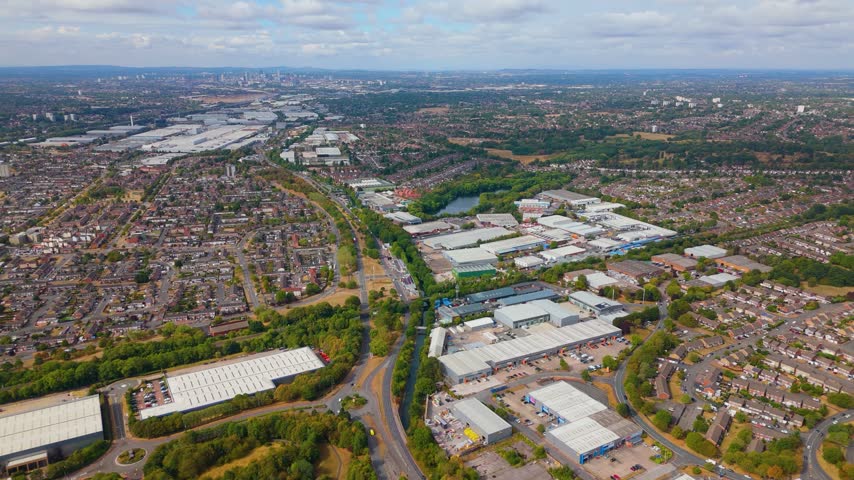 Wide altitude aerial shot of urban landscape and Birmingham skyline