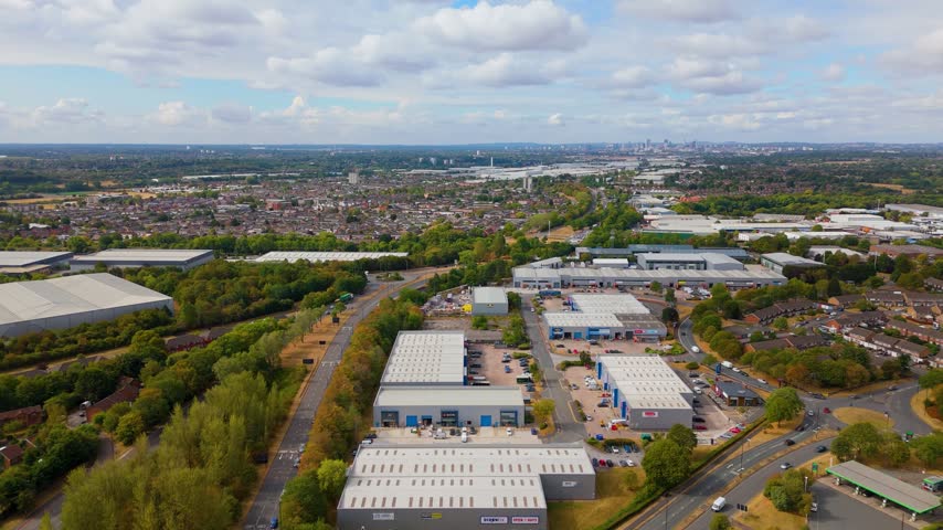 High aerial overview of commercial park and Birmingham city horizon