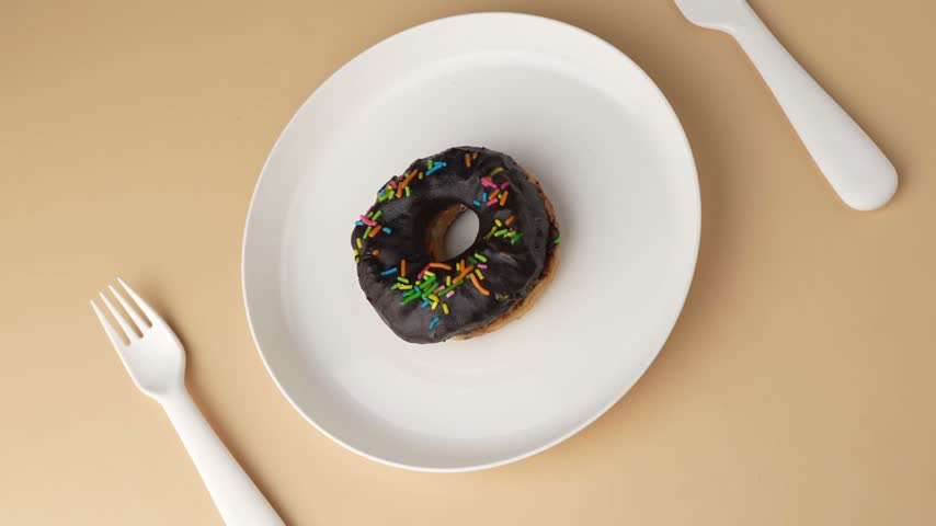 Chocolate Donuts Stacked on White Plate