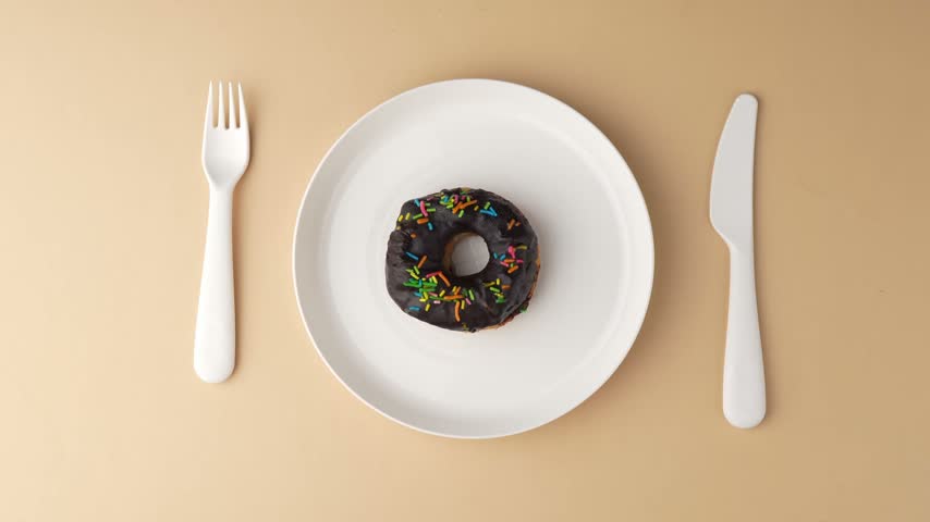 Chocolate Donuts Stacked on White Plate