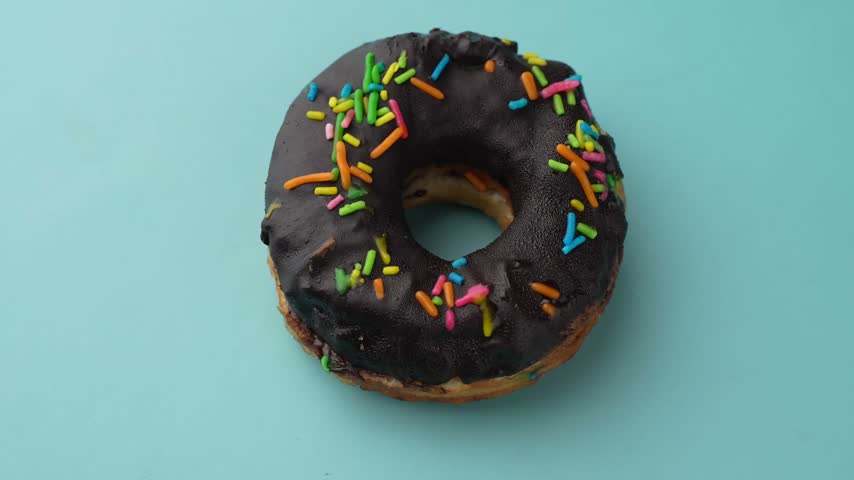 Chocolate Donuts Stacked on White Plate