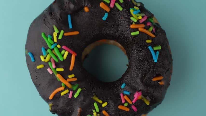 Chocolate Donuts Stacked on White Plate