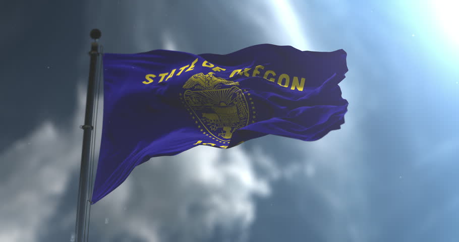 Oregon state flag waving on a flagpole against a cloudy sky