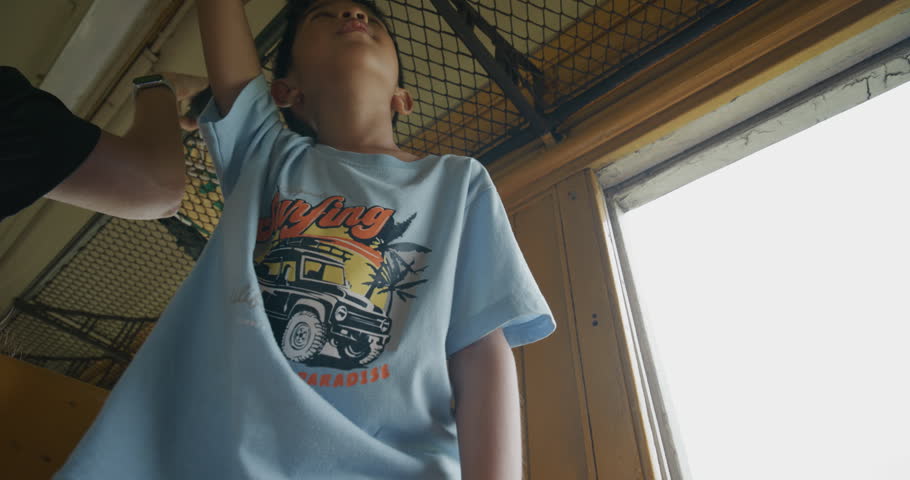 Little asian boy enjoy travel in local old train backpacker kids Thailand