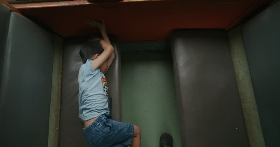 Little asian boy enjoy travel in local old train backpacker kids Thailand