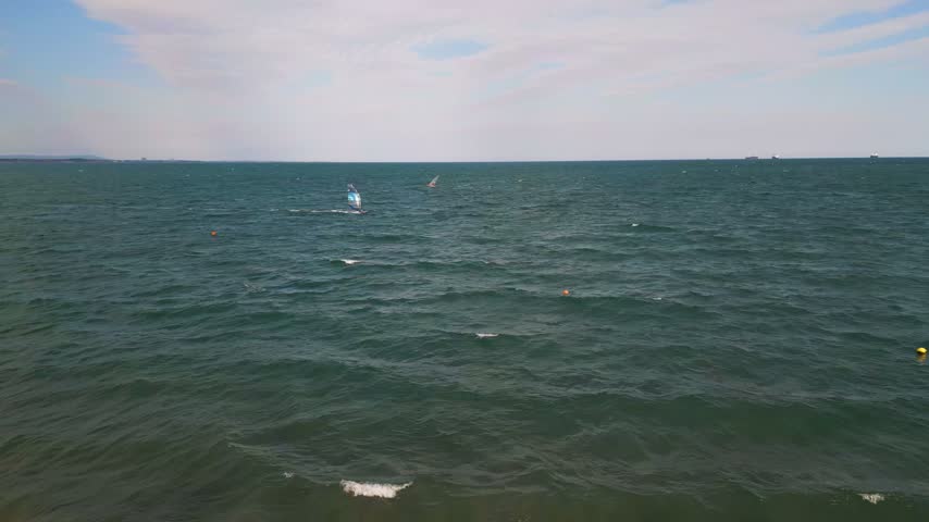 Windsurfer Riding Waves in Open Sea, Windsurfing Extreme Sport Activity