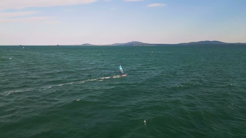 Windsurfer Riding Waves in Open Sea, Windsurfing Extreme Sport Activity