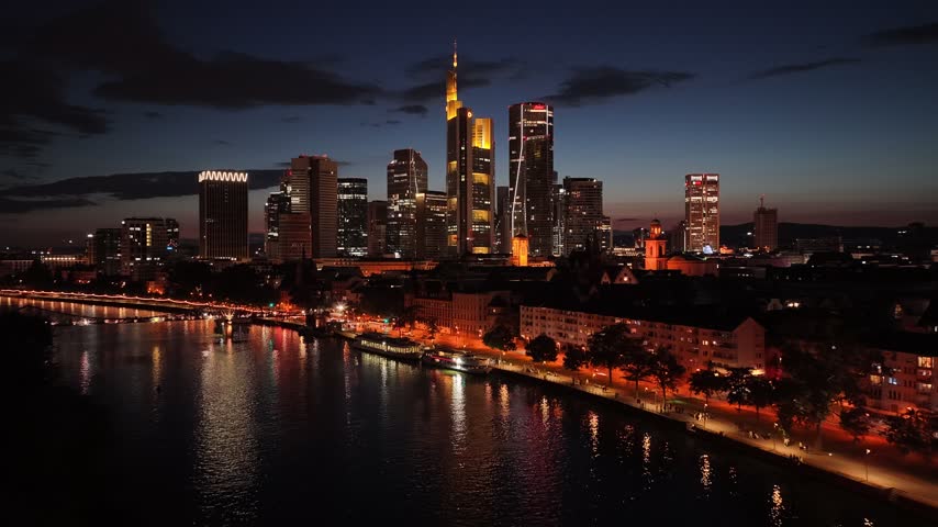 Night over Frankfurt Skyline In Hesse Germany. Illuminated City. Downtown District. Highrise Buildings. Frankfurt Skyline In Frankfurt In Hesse Germany. Beautiful Cityscape. European Skyline.
