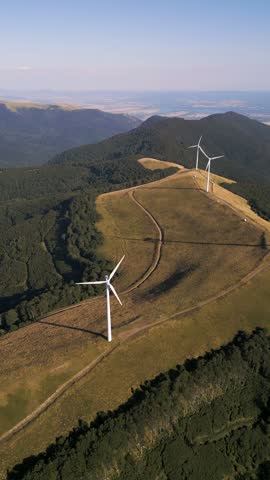 Aerial View of Wind Turbines Windmill Farm on Mountain Ridge at Sunset