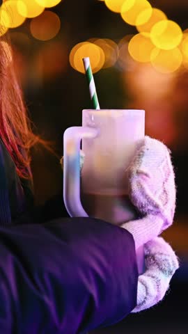Girl Holding Cocoa At Christmas Market In The Evening. Close-up, Vertical Video