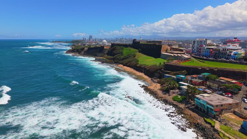 Cinematic Oceanfront Drone Sweep over La Perla San Juan Coastline