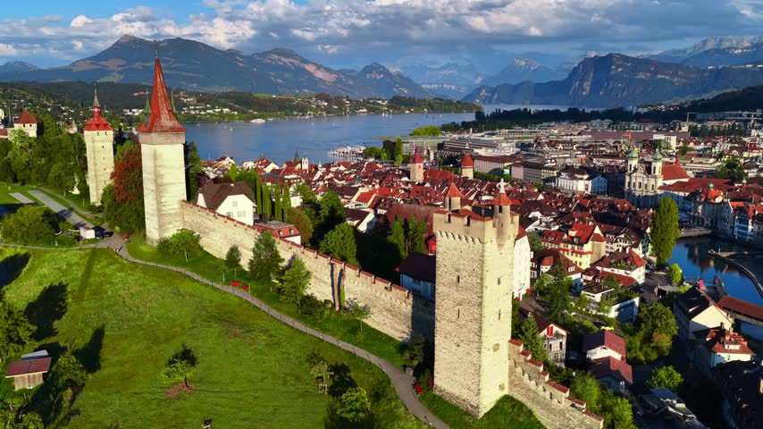 drone view of historic Swiss town of Lucerne in Switzerland, flying above Luzern, medieval Chapel bridge and Lucerne lake, tourism and travel in Switzerland