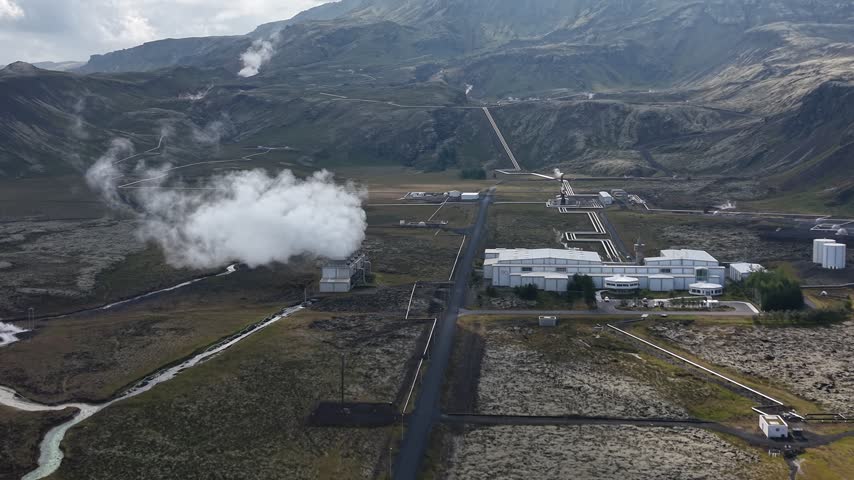 Aerial view of Nesjavellir Geothermal Power Station with steam rising from industrial facilities in the volcanic landscape of Selfoss, Grimsnes- og Grafning, Iceland.