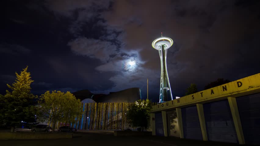 Time Lapse on a Cloudy Night in Seattle by the Space Needle with Moon Rising