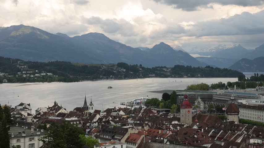 View of the historic city of Lucerne with its traditional rooftops, the lake, and distant mountains in Lucerne, Lucerne, Switzerland.
