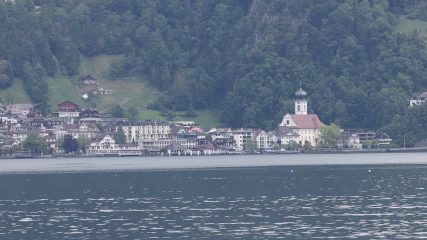View of Lake Lucerne with the historic town and church architecture along the waterfront in Lucerne, Lucerne, Switzerland.