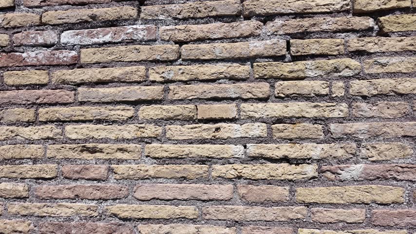 Detailed Close-Up Texture Of A Weathered Red Brick Wall