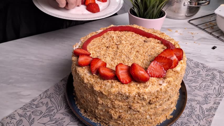 Decorating a Delicious Layered Cake with Fresh Strawberries and Sweet Glaze, Showcasing the Art of Cake Presentation and Culinary Creativity