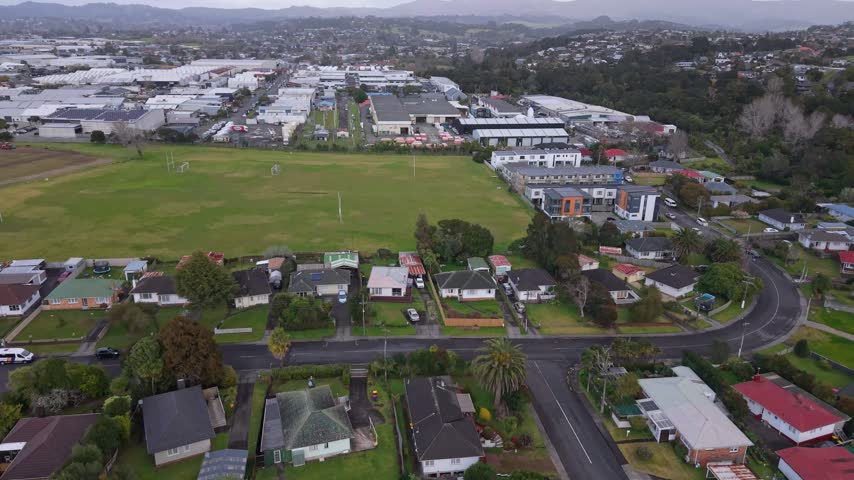 Drone footage showing Henderson’s urban landscape, with a large open green field surrounded by commercial buildings, industrial areas and residential neighbourhoods.
