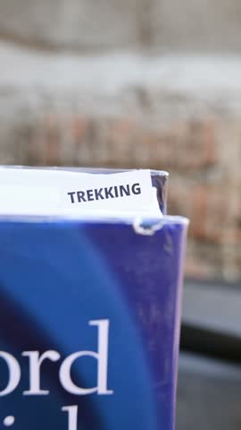 Trekking Word on White Paper Representing Hiking Exploration and Nature Travel