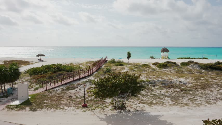Coastal landscape Jardines del Rey Cuba sandy dunes sparse coastal turquoise ocean overcast sky