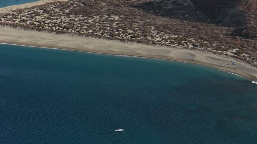Aerial view of a small boat off the coast of Isla Cerralvo, Baja California Sur.