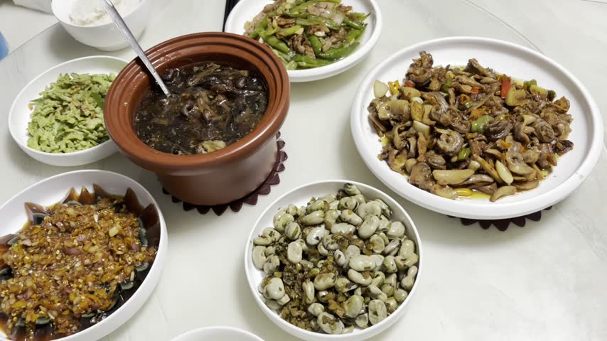 Close up of a Chinese banquet in Hunan, comprehensive of various traditional spicy dishes of the region.