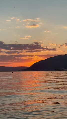 Red sunset glowing over calm Adriatic water