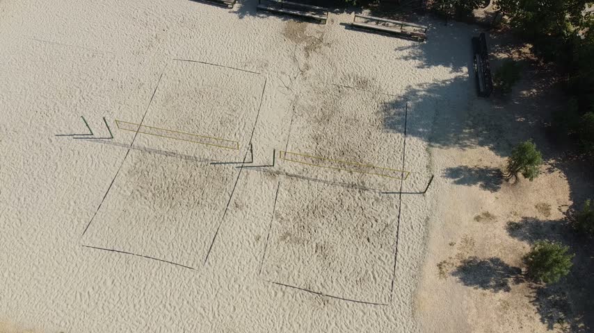 Aerial Top Down Static Hovering Shot Over Sand Beach Volleyball Courts 4K