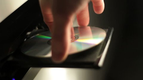 Insert and eject a cd in a player. Find similar clips in our portfolio.