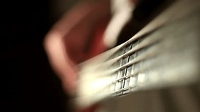 Close-up of hands of a bass guitar player. Find similar clips in our portfolio.