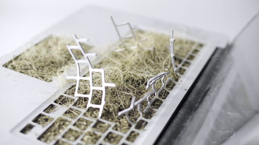 Post apocalyptic laptop reclaimed by nature with dried grass and No War message
