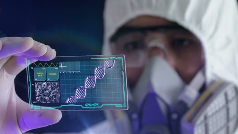 HD 1080 video of a male scientist analyzing structure of a DNA on a tablet in a modern laboratory environment