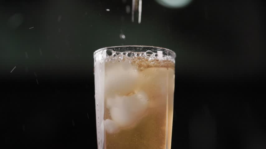 Fresh Peach Extract Juice With Ice Cubes Close Up Bubbles Slow Motion
Close-up slow motion shot of a refreshing peach extract juice drink with ice cubes in a glass. Tiny bubbles and the chilled golden beverage are shown in detail, highlighting the fresh and refreshing qualities of the finished fruit drink. Ideal for summer beverage, fruit juice, food, commercial advertising, lifestyle, and refreshing drink projects.