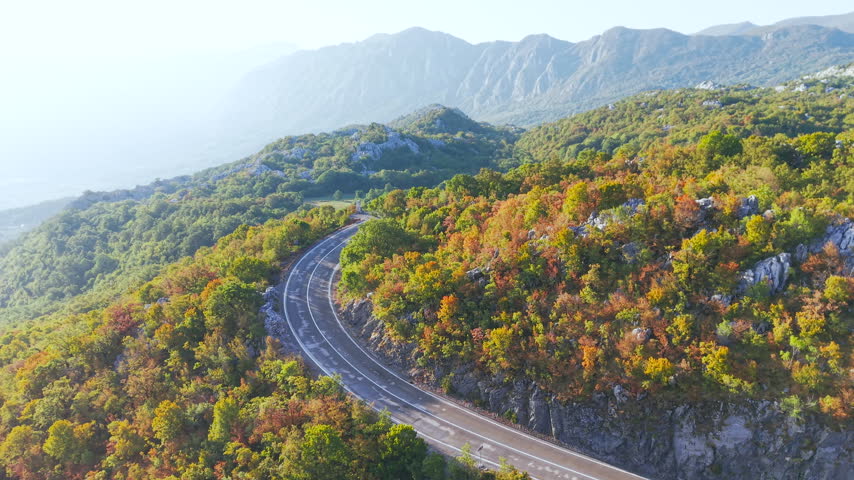 Montenegro mountain serpentine road near Podgorica with autumn forest and rocky mountains